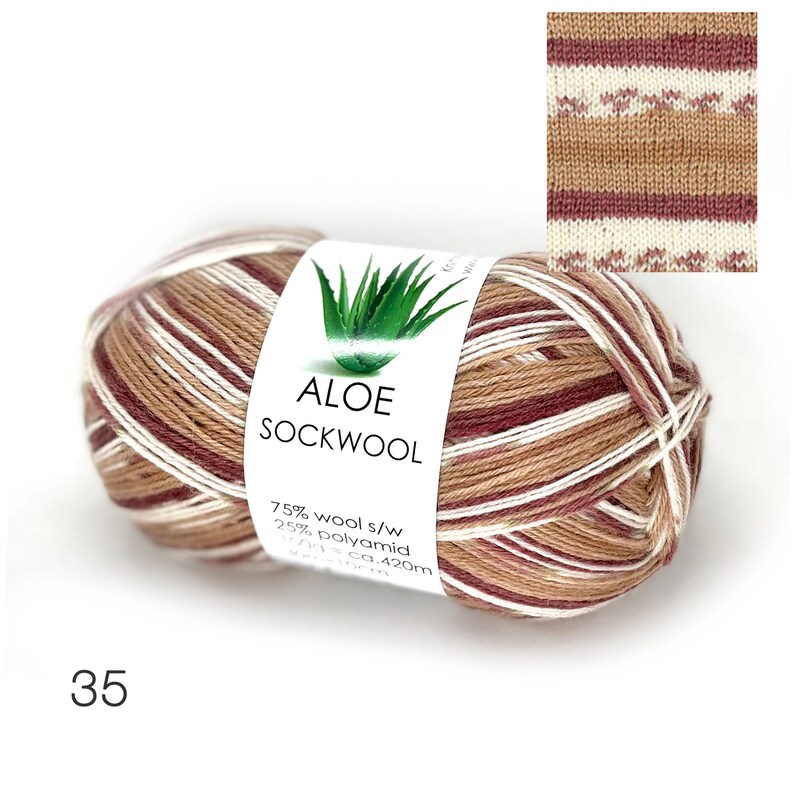 May include: A skein of brown, white, and red striped sock yarn with a label that reads "Aloe Sockwool 75% wool s/w 25% polyamid 100g = ca. 420m".