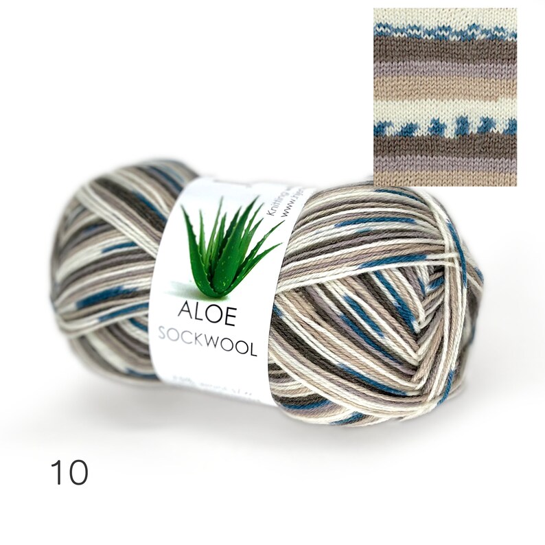 May include: A skein of Aloe Sockwool yarn in color #10, a multi-colored yarn with stripes of beige, brown, white, and blue. The yarn is wrapped around a label that says "Aloe Sockwool" and features a picture of an aloe plant.