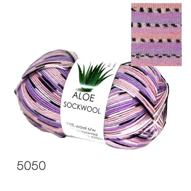 May include: A skein of pink, purple, and black striped yarn with a label that reads "Aloe Sockwool" and "75% wool s/w 25% polyamid 420m".