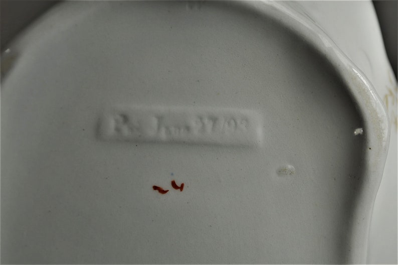 Picture of the possible run number and date or serial numbers on the bottom of the dish.
