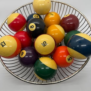 vintage pool billiard balls set of 15 includes cue ball and 8 ball number 12 is missing vintage silver tone wire basket included
