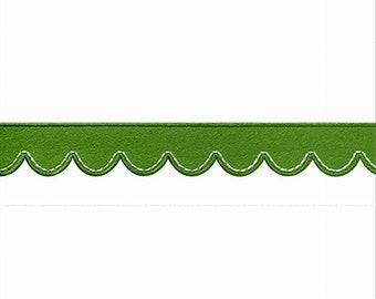 May include: A white card with a green scalloped border. The border has a white stitching detail.