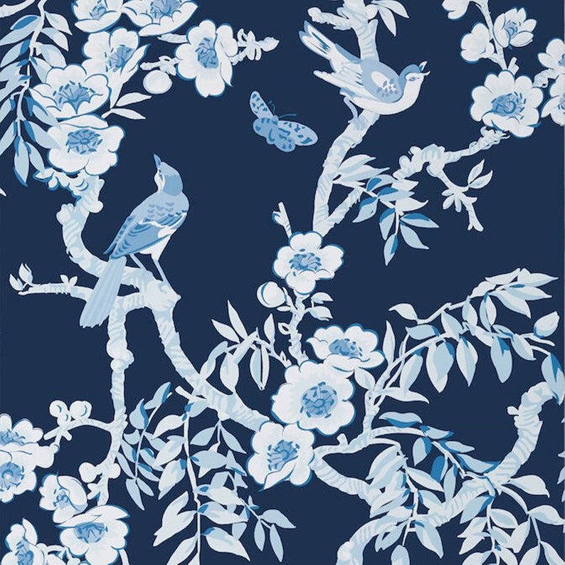 May include: A blue and white floral pattern with birds and butterflies on a dark blue background. The design features stylised branches, leaves, and flowers.