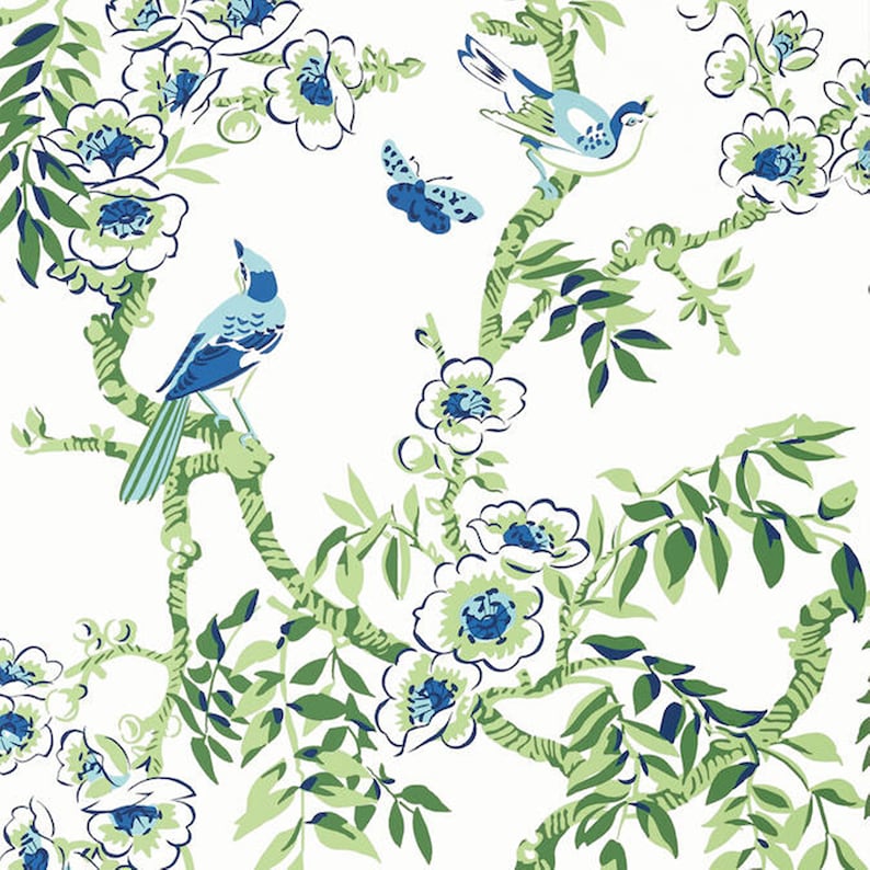 May include: A white background with a blue and green floral pattern. The pattern features stylised flowers, leaves, and birds. The birds are blue with white accents.