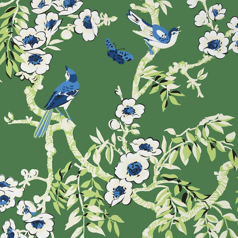 May include: A green background with white flowers and blue birds. The flowers have white petals and blue centres. The birds are perched on branches with white bark. The branches are intertwined with green leaves.