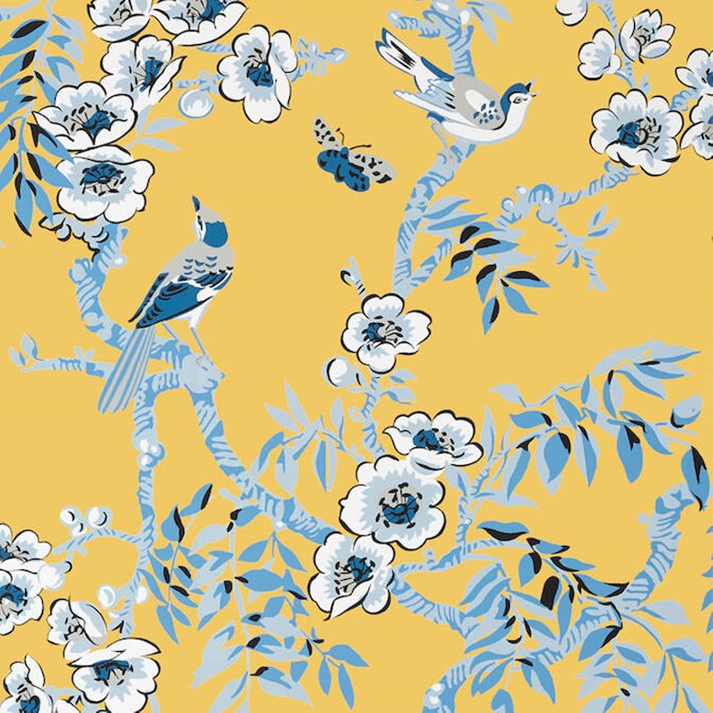 May include: A yellow background with a blue and white floral pattern and blue birds. The flowers are stylised and have a white centre with a blue centre. The birds are perched on branches.
