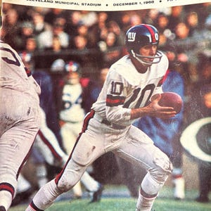 May include: Vintage football program cover featuring the Giants vs. Browns game at Cleveland Municipal Stadium on December 1, 1968. The cover shows a player in a white uniform with the number 10, holding a football. The program cost fifty cents.