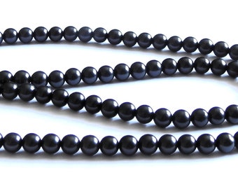 Shungiet ketting 8 mm. Kralen 75 cm. Bescherming tegen elektromagnetische velden en helende werking.