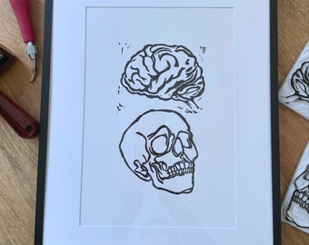 Linoprint van hersenen en schedel: handgemaakte A4-posterkunst