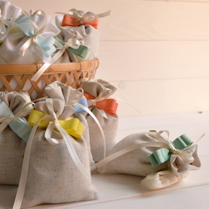 mixed linen sandy bags, with sugared almonds, mixed color ribbons, coral, yellow, light green, light blue, light blue