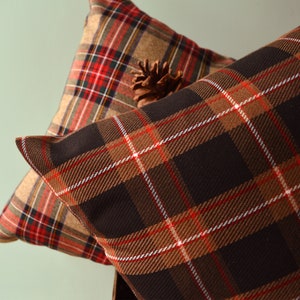 Black, sand, red tartan print cushion. Christmas decorative cushions, coordinated  blankets, decorative cushions, tartan Christmas cushions
