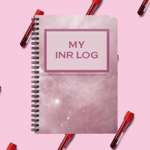 May include: A spiral-bound notebook with a dusty pink nebula-inspired cover featuring a rectangular frame containing the text MY INR LOG in dark pink letters. The notebook is surrounded by several glass medical test tubes with red caps.