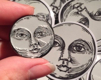 Enamel gun metal grey moon face glow in the dark pin badge