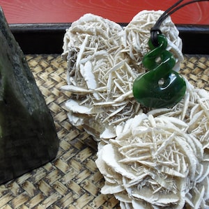 A Triple Twist Jade Pendant