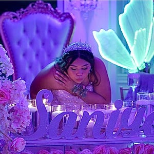 Custom wooden name sign in blue neon light setting, princess theme Quinceañera gift centerpiece