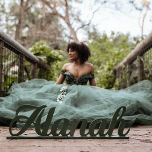 Large personalized name sign in Emerald green finish at outdoor boho Quinceañera garden party