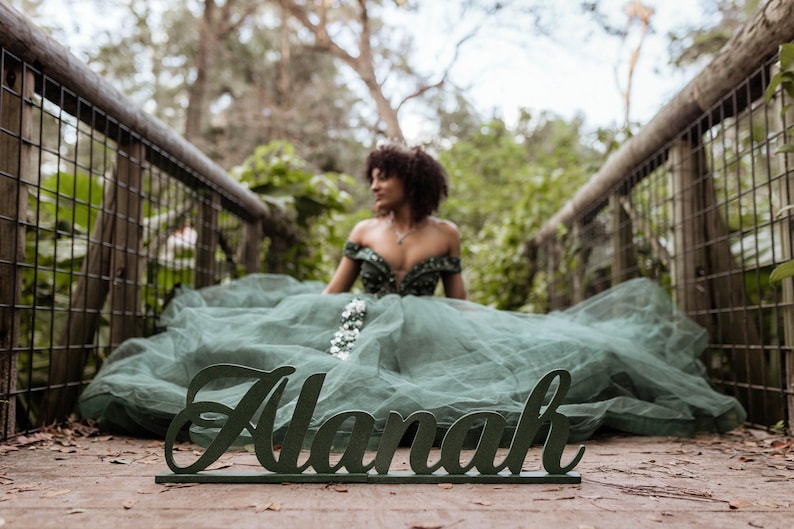Large personalized name sign in Emerald green finish at outdoor boho Quinceañera garden party