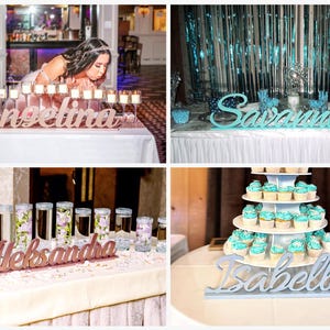 Multiple personalized name signs displayed at teal decorated Quinceañera party table, gift keepsakes