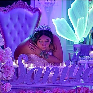 Large custom wooden name sign in blue neon light setting, princess theme Quinceañera mis quince decor