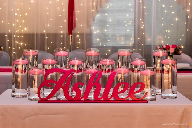 Personalized name sign in pink glitter finish with string lights, elegant Quinceañera gift keepsake