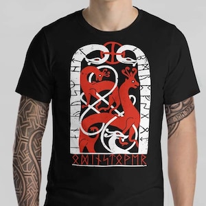 May include: Black t-shirt with a white and red graphic design of a stylized animal with runes. The runes read "SMITSTØPMR".