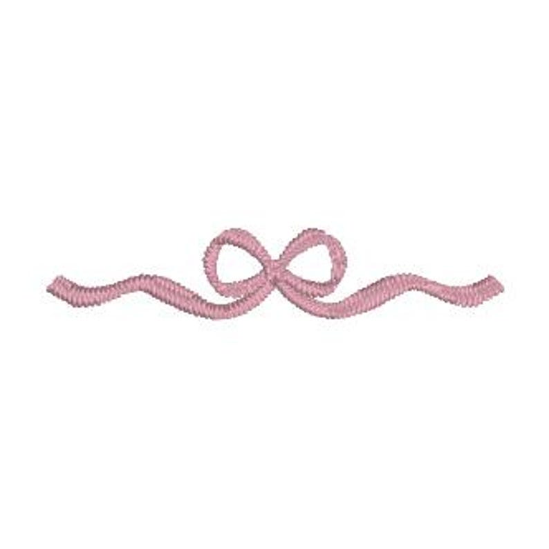 May include: A delicate, embroidered design featuring a pink bow with flowing, wavy lines extending outward. The bow is centered, and the lines create a symmetrical, decorative element. The design is set against a clean white background.