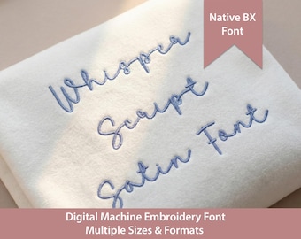 May include: A white fabric swatch featuring blue machine-embroidered text that reads Whisper Script Satin Font. A pink banner in the upper right corner displays the text Native BX Font, while the bottom banner reads Digital Machine Embroidery Font Multiple Sizes & Formats.