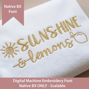 May include: A white fabric featuring gold machine embroidery that reads "SUNSHINE & lemons" with a sun icon and a lemon outline. A pink banner at the top displays "Native BX Font" and the bottom text reads "Digital Machine Embroidery Font Native BX ONLY - Scalable".