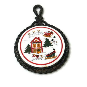 VTG Christmas Trivet Tile Cast Iron Santa Sleigh Reindeers Snowman House (rust)