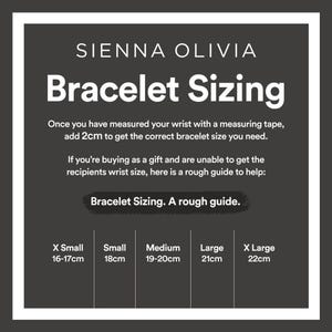 May include: A chart showing bracelet sizing guide for Sienna Olivia jewelry. The chart shows the bracelet size in centimeters for X Small, Small, Medium, Large, and X Large.