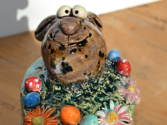 Ceramic garden ball "Easter Bunny Siebelt" in the flower field