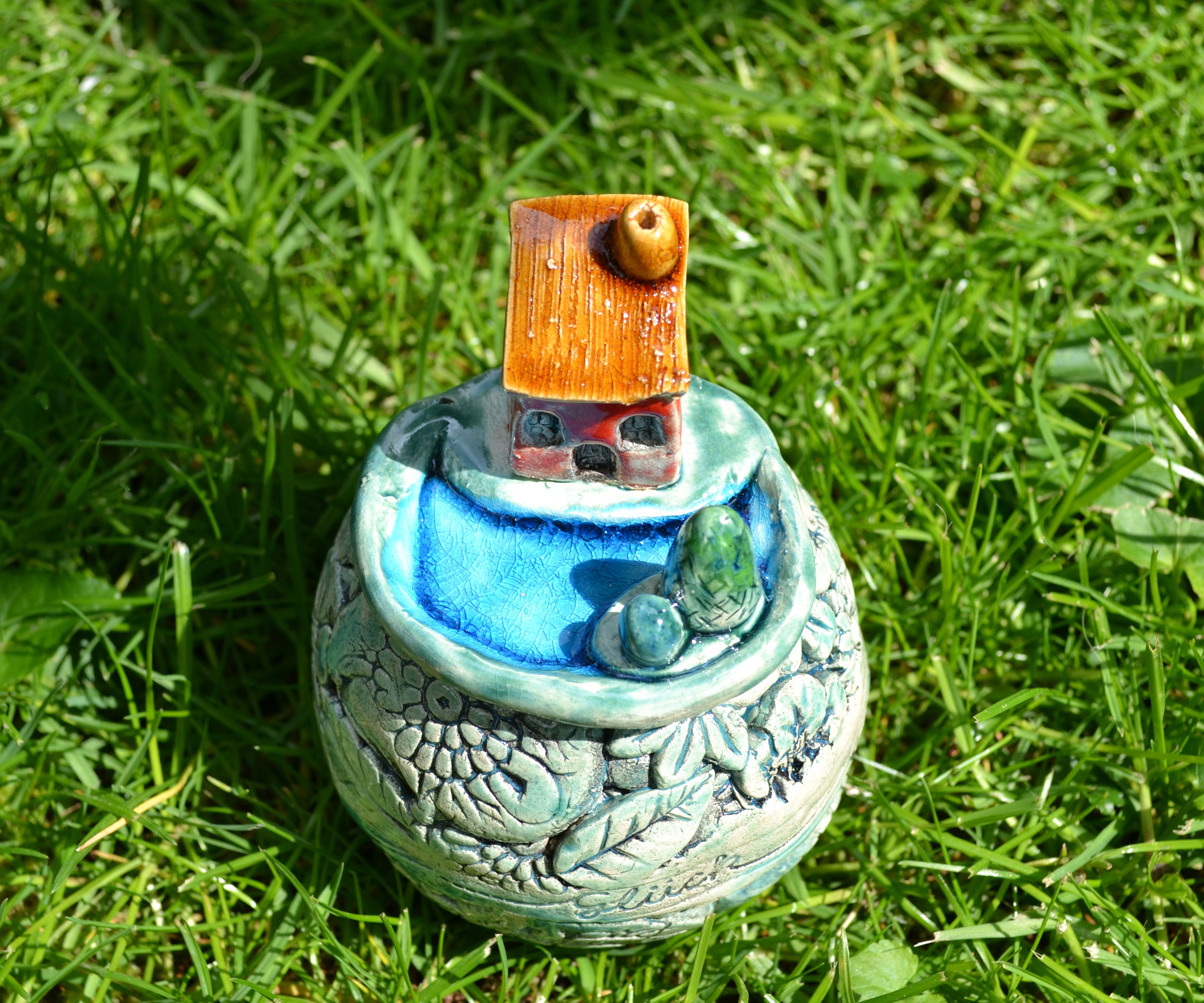 Ceramic garden ball Little worldhouse by the lake