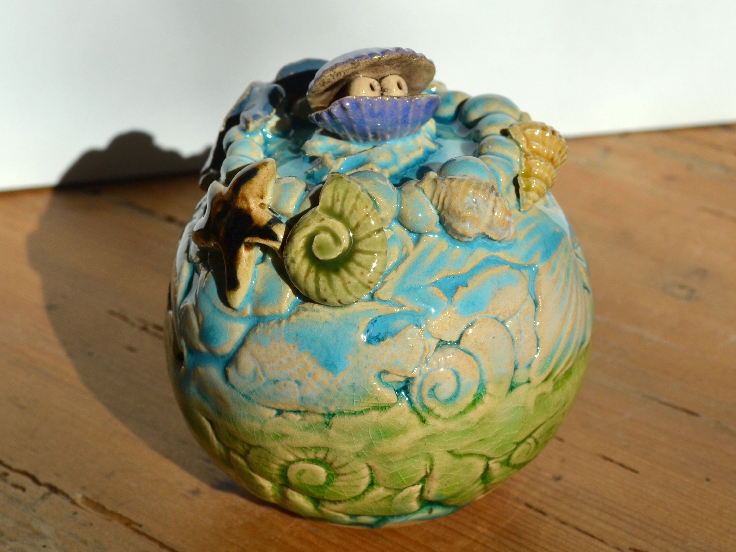 Ceramic garden ball Shells on the beach