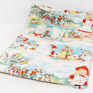 May include: White fabric with a colorful print of characters from Alice in Wonderland. The print includes Alice, the Queen of Hearts, the Mad Hatter, and the Cheshire Cat.