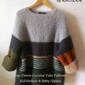 May include: A grey, green, black and orange striped sweater with a circular yoke. The sweater is made of kid mohair and baby alpaca. The text "Top-Down Circular Yoke Pullover" and "Kid Mohair & Baby Alpaca" is printed below the sweater. The text "by KNITLOOK" is printed in the top right corner of the image.