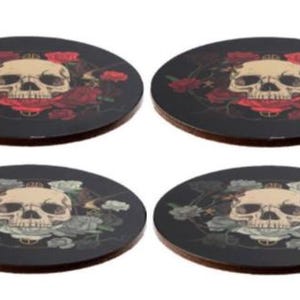 May include: Set of four round coasters featuring a skull surrounded by roses. The coasters have a black background with a skull in the centre, surrounded by red, white, or grey roses.
