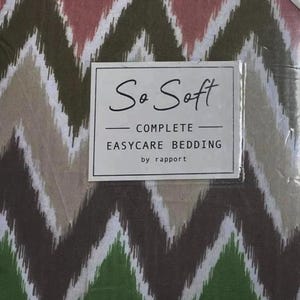 May include: Bedding set featuring a zig-zag pattern in green, brown, pink, and white. The label reads "So Soft COMPLETE EASYCARE BEDDING by rapport."
