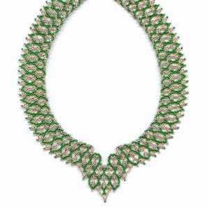 May include: A handcrafted beaded necklace with an openwork design. The necklace features a pattern of green and silver beads, creating a textured effect. The necklace is secured with a silver clasp. The necklace is a piece of jewellery.