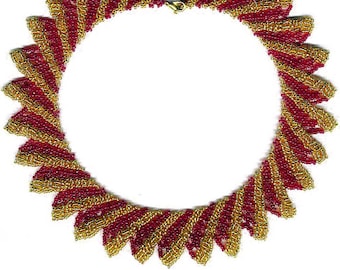 May include: A red and gold beaded necklace with a swirling pattern. The necklace is made of small, round beads that are strung together in a spiral design. The beads are arranged in a way that creates a sense of movement and flow.