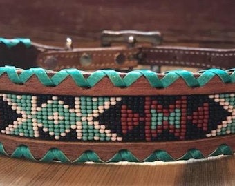 Leather dog collar with teal, white, and burgundy navajo beaded inlay design, a rawhide wrapped edge