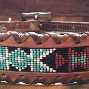 Leather dog collar with teal, white, and black navajo beaded inlay design, a leather wrapped edge