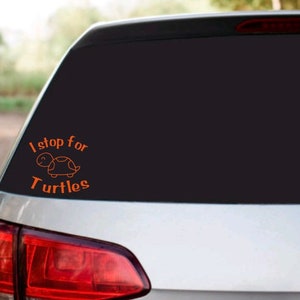 May include: A car with a sticker on the back window that says "I stop for turtles" with a small turtle illustration.