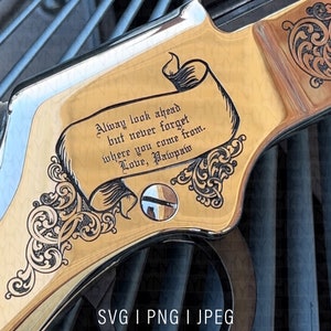 May include: A gold-coloured rifle stock with an engraved inscription that reads "Always look ahead but never forget where you come from. Love, Pawpaw".