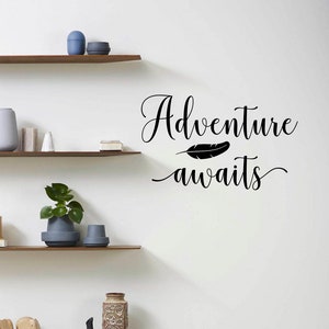 May include: Black and white wall decal with the text "Adventure awaits" and a small feather graphic.
