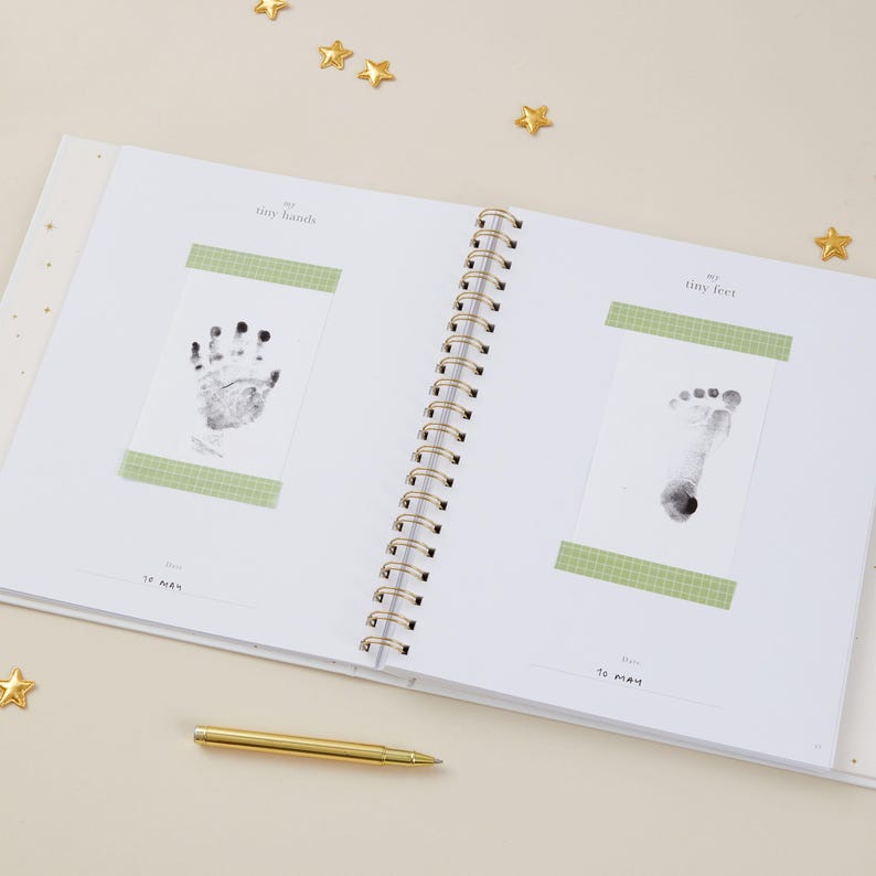 Luxury aqua baby keepsake book with gold foiled accents. Inside are 114 guided pages to help parents document milestones from pregnancy through age 5, with space for photographs and personal notes. This gender-neutral baby record book is designed to be inclusive for all families. With its timeless cloth cover and foiled gift box, this aqua baby milestone journal makes a meaningful baby shower or new parent gift.