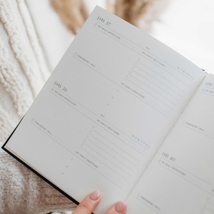 Op de afbeelding: Een witte planner met zwarte tekst, getiteld "Dag 37" en "Dag 38". De planner heeft secties voor "Mijn dagelijkse intenties", "Mijn dagelijkse zelfzorg" en "Mijn dagelijkse dankbaarheid".