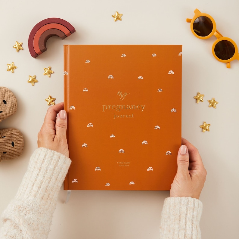 Explore our pregnancy journal with a beautiful rainbow theme, perfect for baby showers and as a thoughtful gift for your pregnant friend.