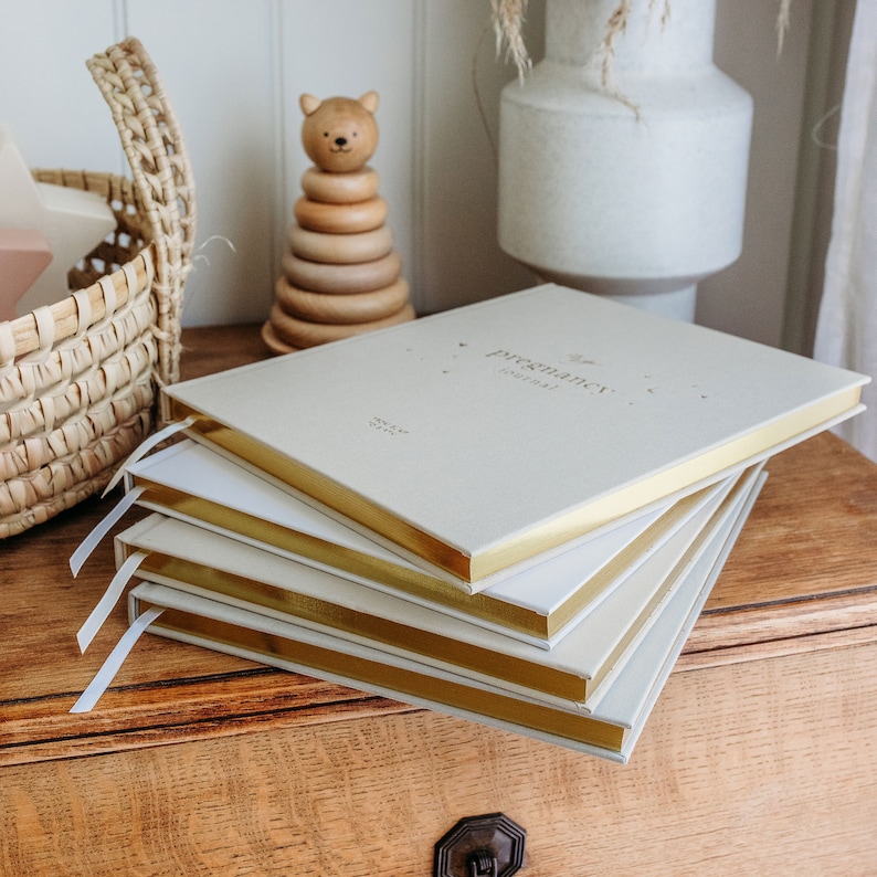 Beautiful pregnancy journal with elegant design, the perfect baby shower gift for expecting parents to document their journey.