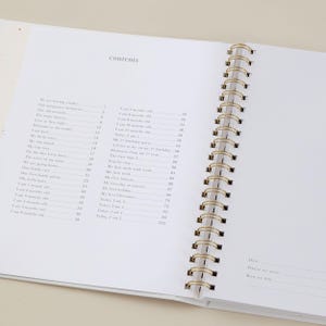 Aqua baby record book crafted with a light blue cloth cover and luxury gold foil decoration. This baby milestone journal includes 114 guided pages for capturing memories and milestones from pregnancy through early childhood, with space to add personal stories and photographs. Completely gender-neutral and inclusive, this memory book is perfect for all families. Packaged in a matching foiled presentation box, it makes a beautiful baby shower gift.