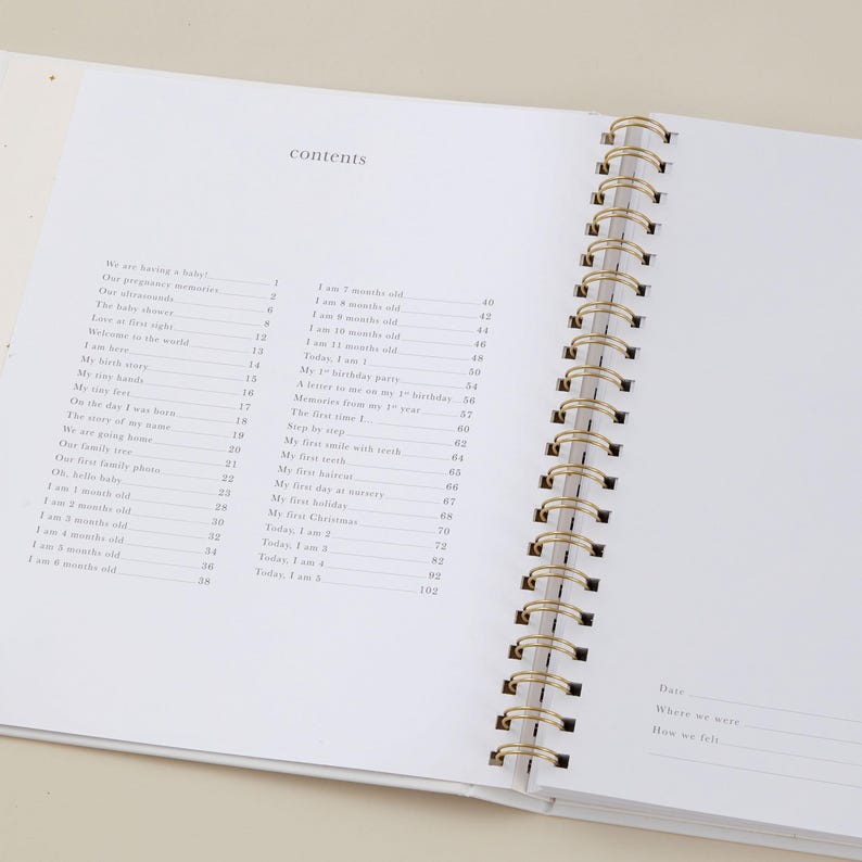 Aqua baby record book crafted with a light blue cloth cover and luxury gold foil decoration. This baby milestone journal includes 114 guided pages for capturing memories and milestones from pregnancy through early childhood, with space to add personal stories and photographs. Completely gender-neutral and inclusive, this memory book is perfect for all families. Packaged in a matching foiled presentation box, it makes a beautiful baby shower gift.